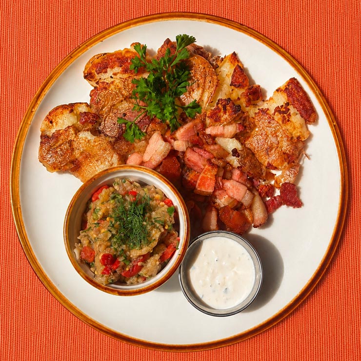 Crispy Smashed Potatoes with Bacon & Fried Eggplant Salad Crispy Smashed Potatoes with Bacon & Fried Eggplant Salad at Café Dacha in Sunny Isles Beach